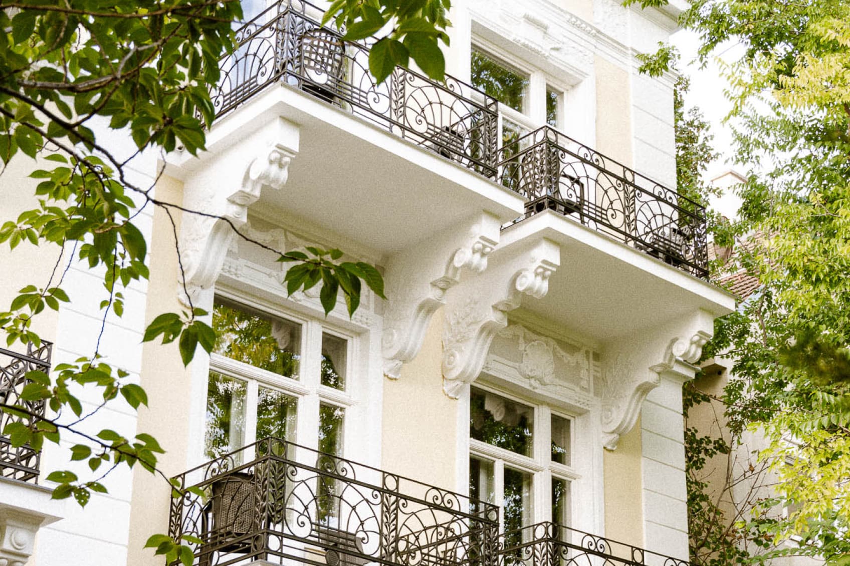 Seen is the backside of the newly opened hideauts hotels Villa R. The hotel was fully rennovated and the exterior newly painted in a dark yellow colour.