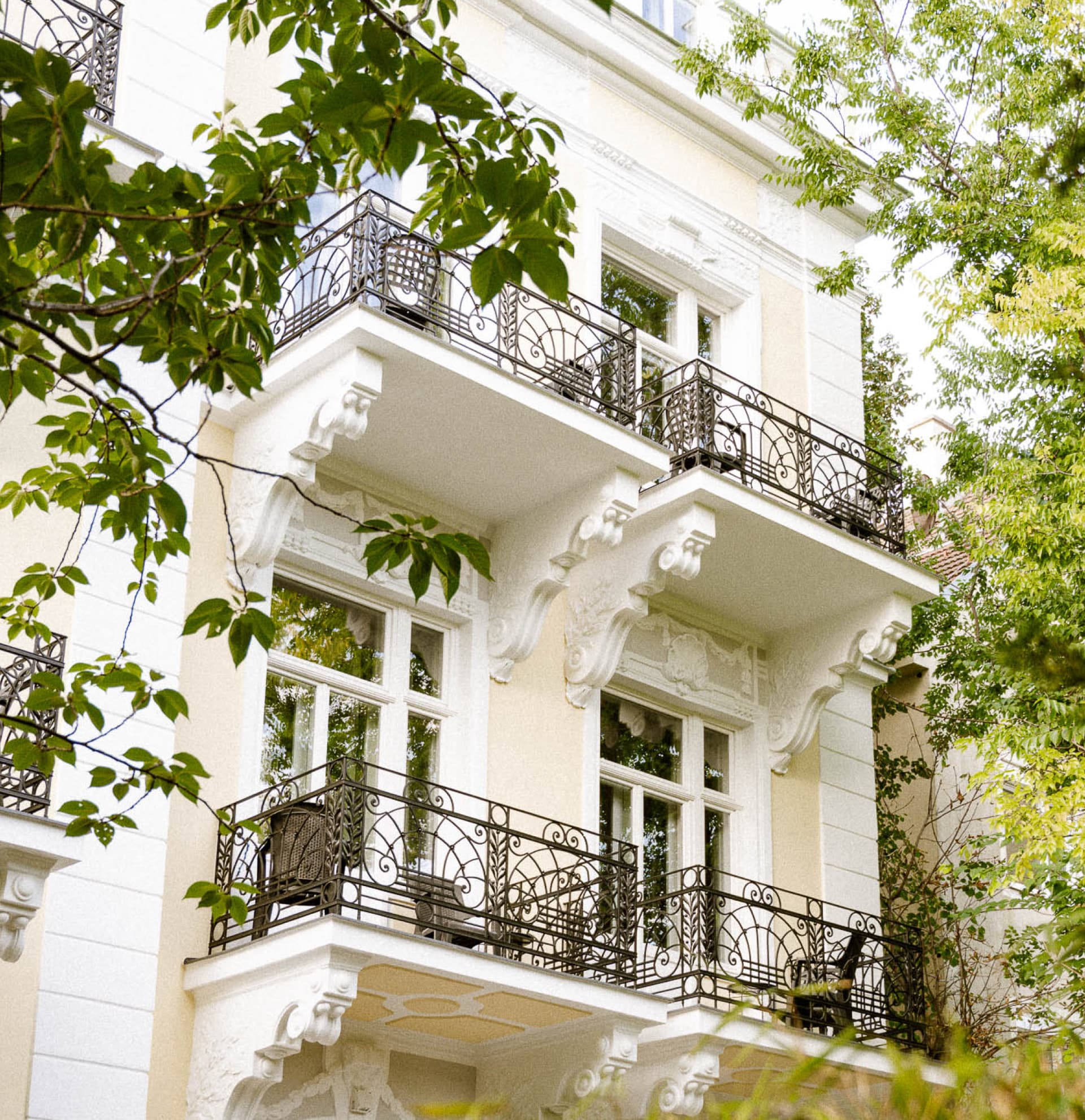 Seen is the backside of the newly opened hideauts hotels Villa R. The hotel was fully rennovated and the exterior newly painted in a dark yellow colour.